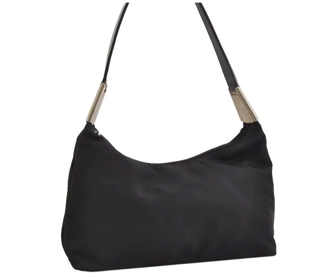 Preloved PRADA Nylon Tessuto Leather Shoulder HandBag (Category: Luxury Bags & Wallets) located in Makati City. Submitted by luxebyjoyce (Listing ID 1298256007, Image 1). Description: Authentic 💯 No inclusions Nylon material Issues: Signs of usage. Color: Black with silver hardware Rank B Location: Makati MOP: BPI and Gcash .