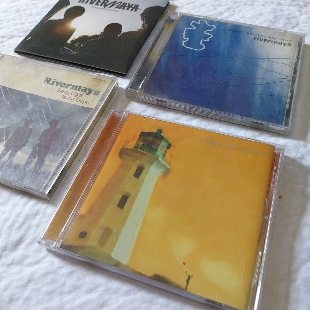Rivermaya CD Set OPM (Category: CDs & DVDs) located in San Pascual. Submitted by mariecarlaph (Listing ID 1298131511, Image 3). Description: P4K take all, free shipping. P1,200 each plus fixed SF P150. Tuloy ang Ligaya, Panatang Makabanda, Between the Stars and Waves. P1K Isang Ugat, Isang Dugo. Issue with Track 1 playback, skips. See video(s) and MORE BOOKS at IG mariecarlaph. All prices are fixed/last price. Modes of payment: BDO, BPI, PNB and 