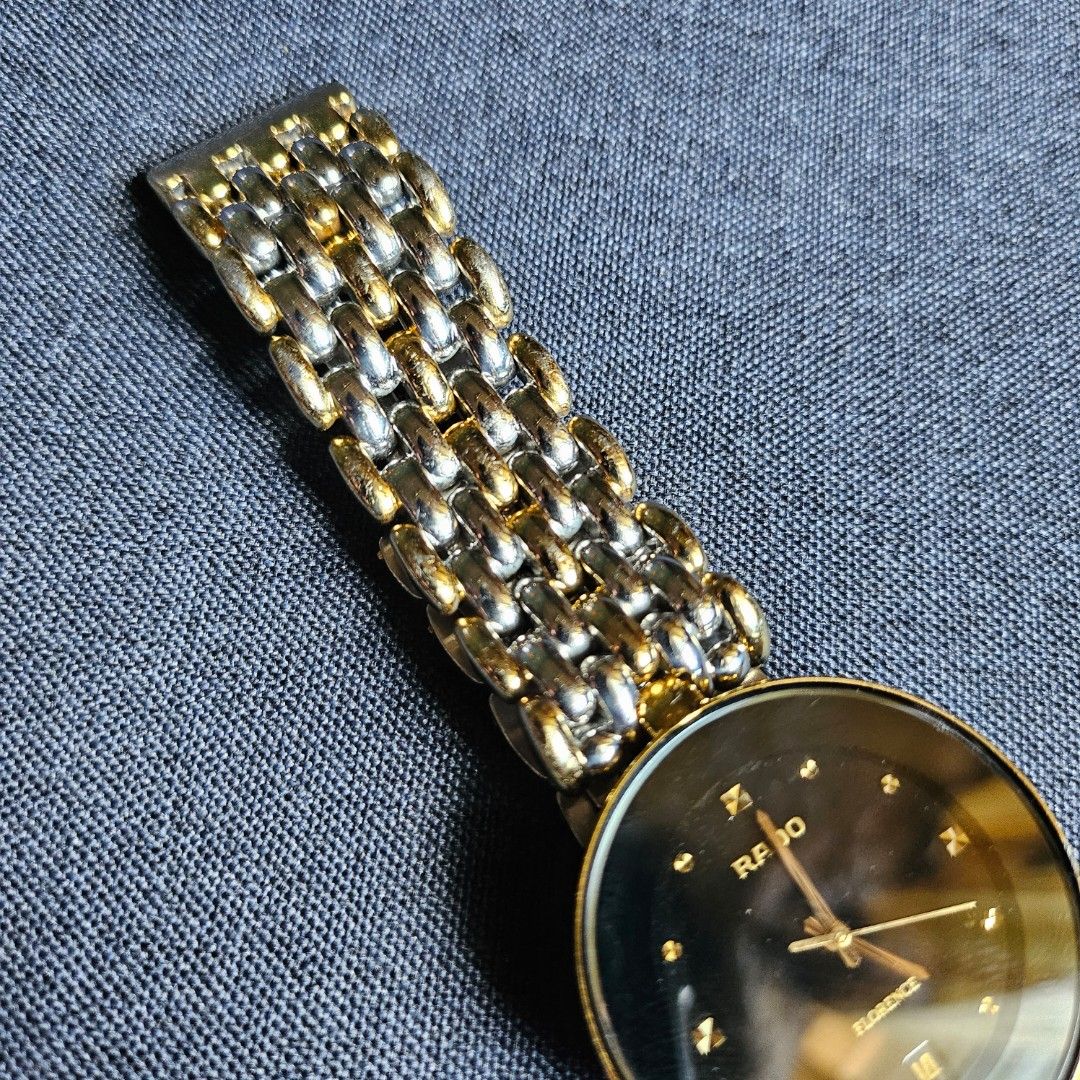 (SELLING LOW) RADO FLORENCE WITH ISSUE (Category: Luxury Watches) located in Quezon City. Submitted by gonzzzzz (Listing ID 1298153108, Image 3). Description: SELLING LOW! Rado Florence - Guaranteed authentic - Checked by a watch technician - Minimal light scratches on glass - Overall, the strap is still in good condition except part near the lock (has heavy scratches) Issues: -Lock is a bit deformed but still works. You will need to press down t