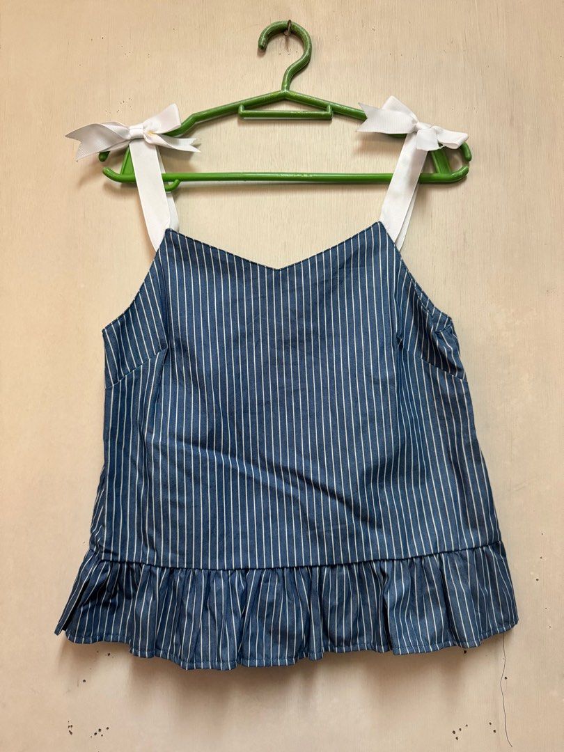 Sleeveless Top (Category: Sleeveless) located in Mandaluyong City. Submitted by atchcatchph (Listing ID 1298206094, Image 1). Description: Cotton material Dark blue with white stripes Fits XS - S Bust 31 below.
