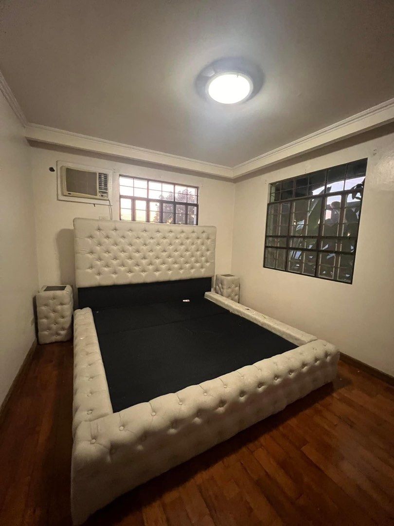 Beige King Sized Bed Frame with Side Tables (Category: Bed Frames & Mattresses) located in Taguig. Submitted by girlbossatwork (Listing ID 1298449537, Image 1). Description: KING-SIZED BEDFRAME. Just needs cleaning. Mattress not included in the price. Combining comfort, style, and durability, this bed frame is a perfect centerpiece for any master bedroom. High Back Frame: The tall, upholstered headboard adds a touch of grandeur and provides excel