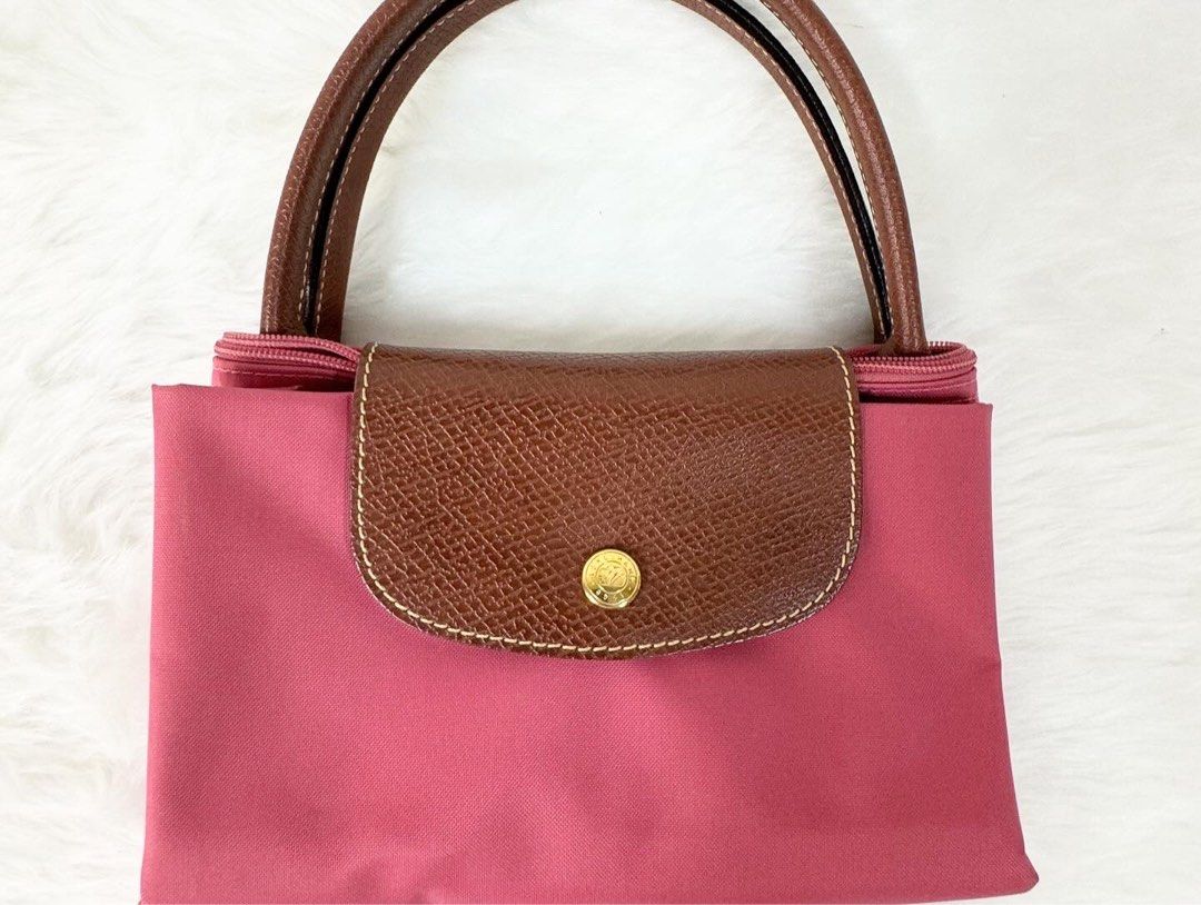 Long champ Le Pliage Medium (Category: Luxury Bags & Wallets) located in San Juan City. Submitted by seeclosetfinds (Listing ID 1298375935, Image 2). Description: LongChamp Le Pliage Medium ( Bright Pink ) Conditon : 9.5/10 Price : P 5500.00 DM for Inquiries.