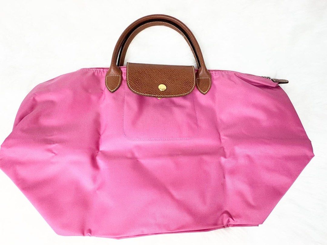 Long champ Le Pliage Medium (Category: Luxury Bags & Wallets) located in San Juan City. Submitted by seeclosetfinds (Listing ID 1298375935, Image 1). Description: LongChamp Le Pliage Medium ( Bright Pink ) Conditon : 9.5/10 Price : P 5500.00 DM for Inquiries.