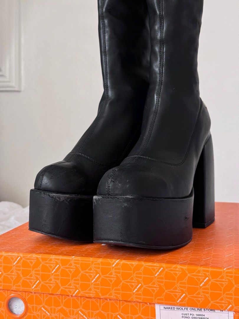 Naked Wolfe Black Spice Knee High Stretch Platform Boots (Category: Boots) located in Calamba. Submitted by dr.kiwi (Listing ID 1298358970, Image 3). Description: Last price posted and for sure buyers only! 🍒Retails for 19,894php 🍒Condition: 8/10 used a few times but has some minor flaws as seen on the pic 🍒Inclusions: Original box + dust bags 🍒Reason for selling: I'm too tall already 🍒Womens size 9 / 25.5cm.