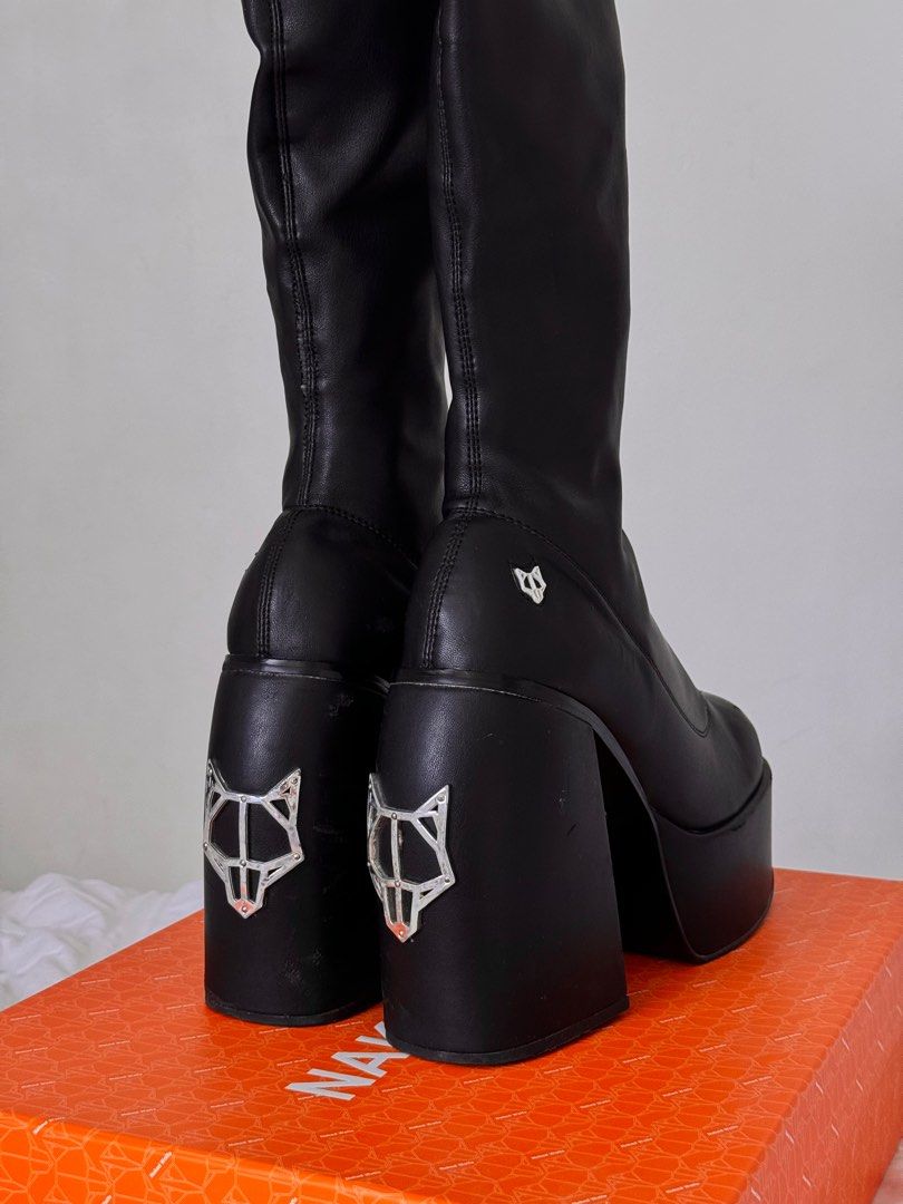 Naked Wolfe Black Spice Knee High Stretch Platform Boots (Category: Boots) located in Calamba. Submitted by dr.kiwi (Listing ID 1298358970, Image 2). Description: Last price posted and for sure buyers only! 🍒Retails for 19,894php 🍒Condition: 8/10 used a few times but has some minor flaws as seen on the pic 🍒Inclusions: Original box + dust bags 🍒Reason for selling: I'm too tall already 🍒Womens size 9 / 25.5cm.
