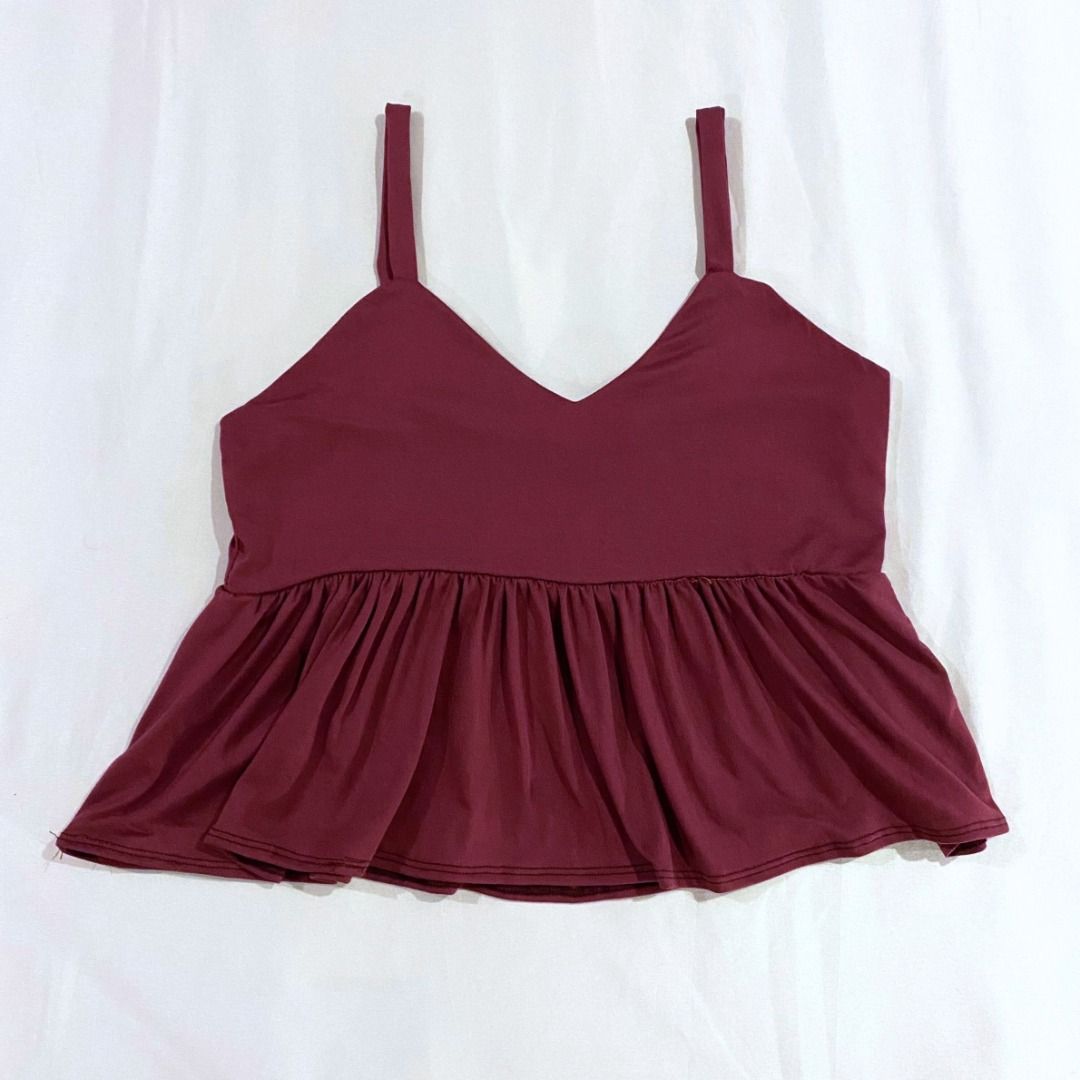 Sleeveless Peplum Blouse in Plum (Category: Sleeveless) located in Makati City. Submitted by sofbetes (Listing ID 1298425404, Image 1). Description: Size: XS-M Material: Spandex, Cotton - Stretchy, Comfortable - Few loose threads RFS: Decluttering 💲 MOP: Gcash, BDO/BPI Bank Transfer 📦 Delivery: GrabExpress, Lalamove ⌛️ Shipping: Within 1-3 days.