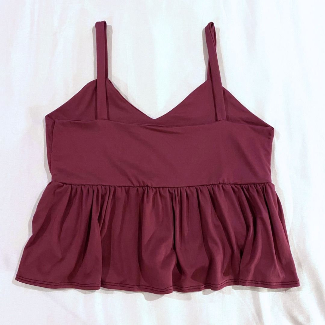 Sleeveless Peplum Blouse in Plum (Category: Sleeveless) located in Makati City. Submitted by sofbetes (Listing ID 1298425404, Image 2). Description: Size: XS-M Material: Spandex, Cotton - Stretchy, Comfortable - Few loose threads RFS: Decluttering 💲 MOP: Gcash, BDO/BPI Bank Transfer 📦 Delivery: GrabExpress, Lalamove ⌛️ Shipping: Within 1-3 days.