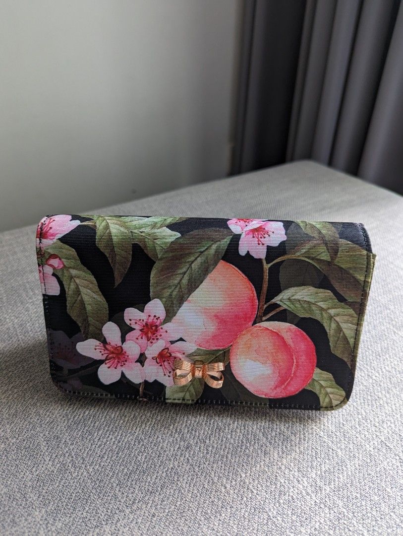 Ted Baker Pauleen Peach Blossom evening bag (Category: Luxury Bags & Wallets) located in Quezon City. Submitted by vert1cal (Listing ID 1298310849, Image 1). Description: Ted Baker Pauleen Peach Blossom evening bag Removable shoulder strap Magnetic closure; lined Interior zip compartment Bow detail 2.6"D x 4"H x 6.8"W; 22" strap drop Imported.