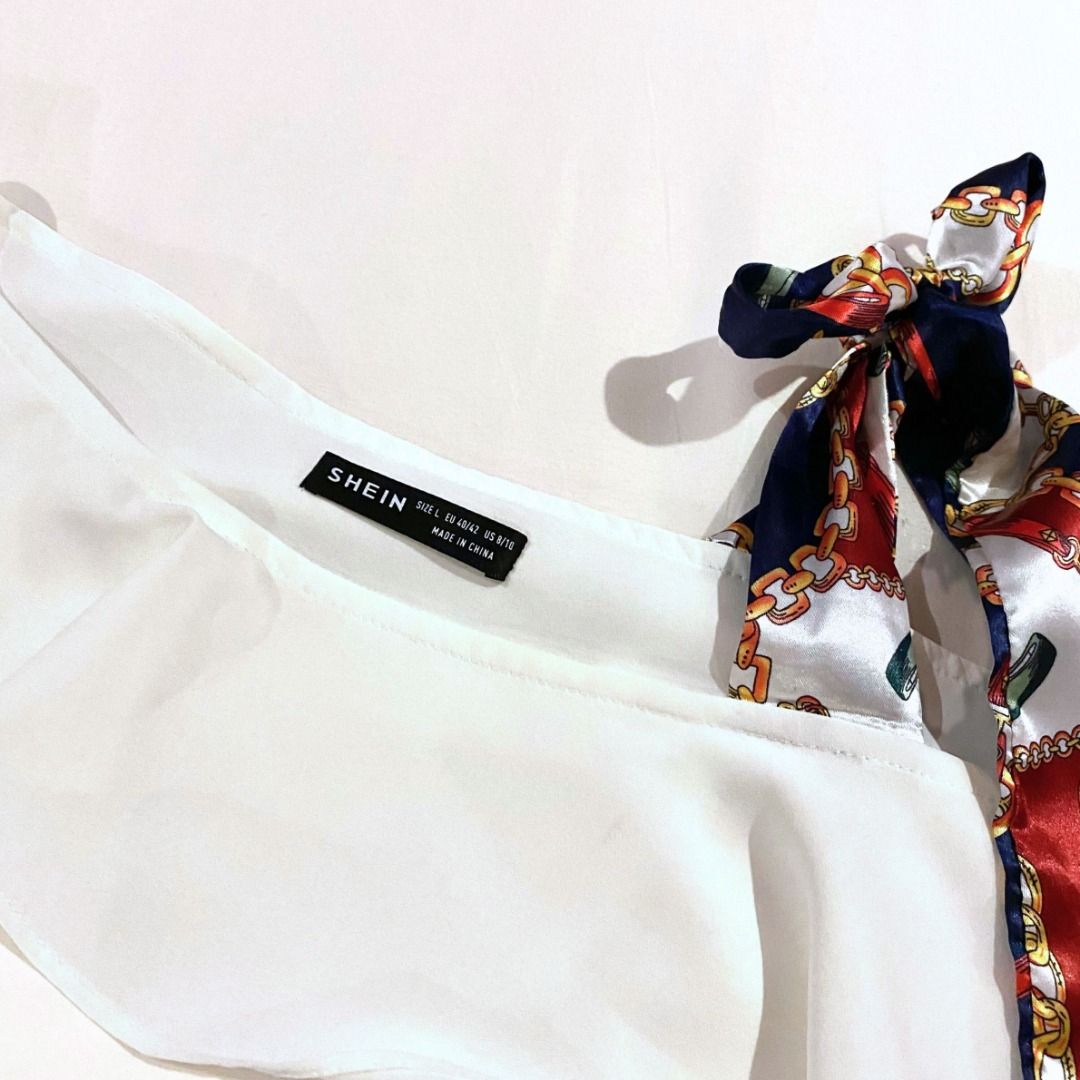White Asymmetrical Long-sleeved Blouse with Tie (Category: Longsleeves) located in Makati City. Submitted by sofbetes (Listing ID 1298432407, Image 2). Description: Size: M-L Material: Polyester - Flowy, loose RFS: Decluttering 💲 MOP: Gcash, BDO/BPI Bank Transfer 📦 Delivery: GrabExpress, Lalamove ⌛️ Shipping: Within 1-3 days.