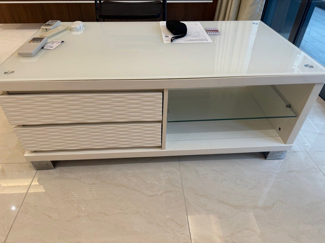 Coffee Table (Category: Tables & Sets) located in Singapore. Submitted by sasa_sj (Listing ID 1298517877, Image 2). Description: Like brand new. White wooden material, top add one more pice glass. Easy keep clean.