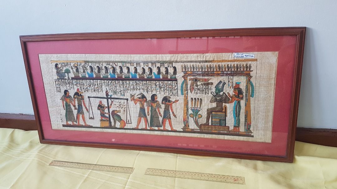 Egyptian papyrus painting wall decor (Category: Wall Decor) located in Quezon City. Submitted by regermax (Listing ID 1298526874, Image 1). Description: Used handpainted Egyptian images on real papyrus wall decor with wood frame and glass. 17 x 37 inches on sale for PHP 5000..