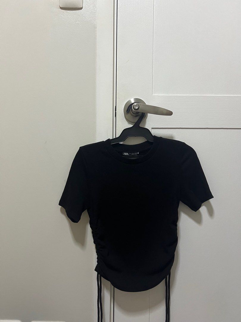 AUTH ZARA Black Ribbed Side Tie Ruched Top (Category: Shirts) located in Quezon City. Submitted by notliese (Listing ID 1298766195, Image 1). Description: AUTHENTIC ZARA Can PM me for more photos or when worn. 📍 QC 📦 Flash Express / Same day delivery within Metro Manila.