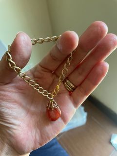 DIY gold tone bracelet with orange stone charm
