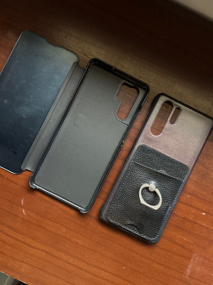 Huawei P30 Pro Cases (Category: Cases & Sleeves) located in Manila. Submitted by posttodispose (Listing ID 1298655610, Image 2). Description: Items have scratches or marks already. One has a cover and the other one has a card holder/ring. Both hard case. .