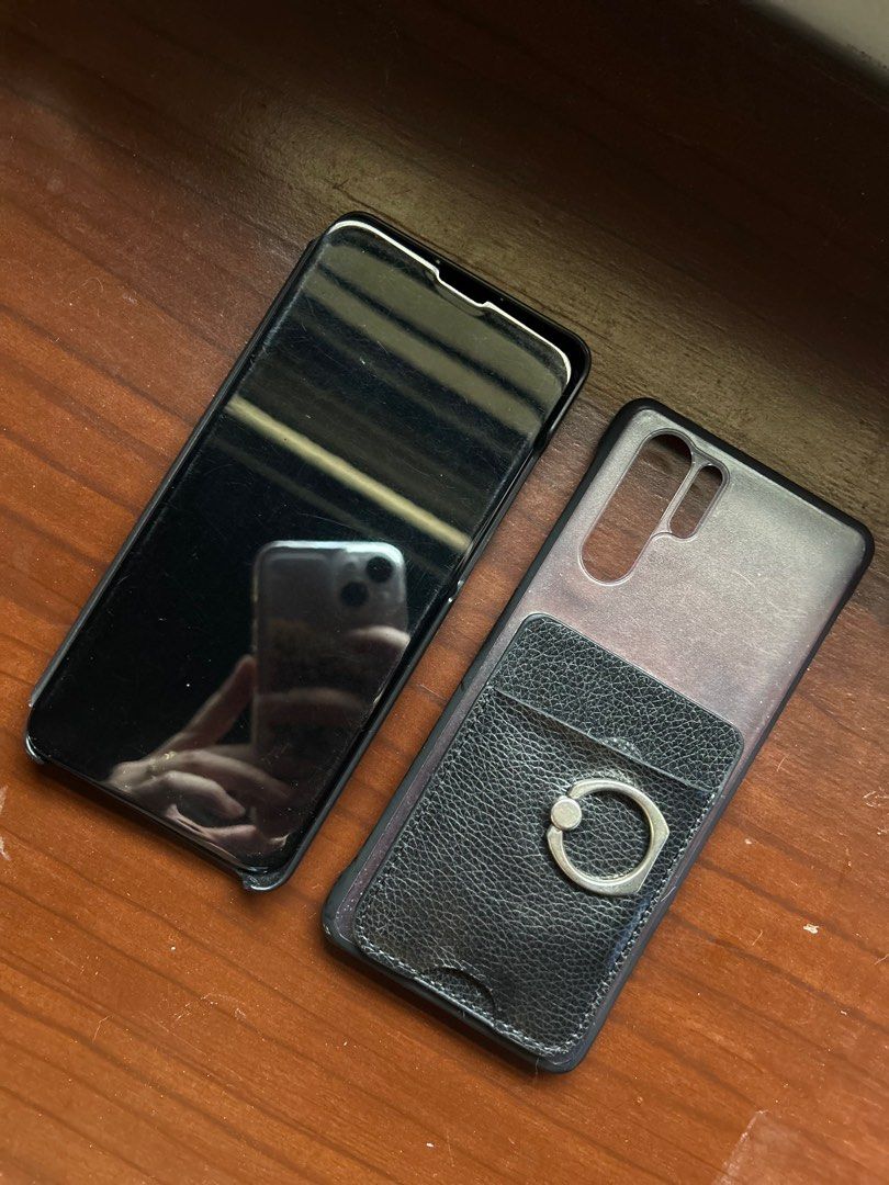 Huawei P30 Pro Cases (Category: Cases & Sleeves) located in Manila. Submitted by posttodispose (Listing ID 1298655610, Image 1). Description: Items have scratches or marks already. One has a cover and the other one has a card holder/ring. Both hard case. .