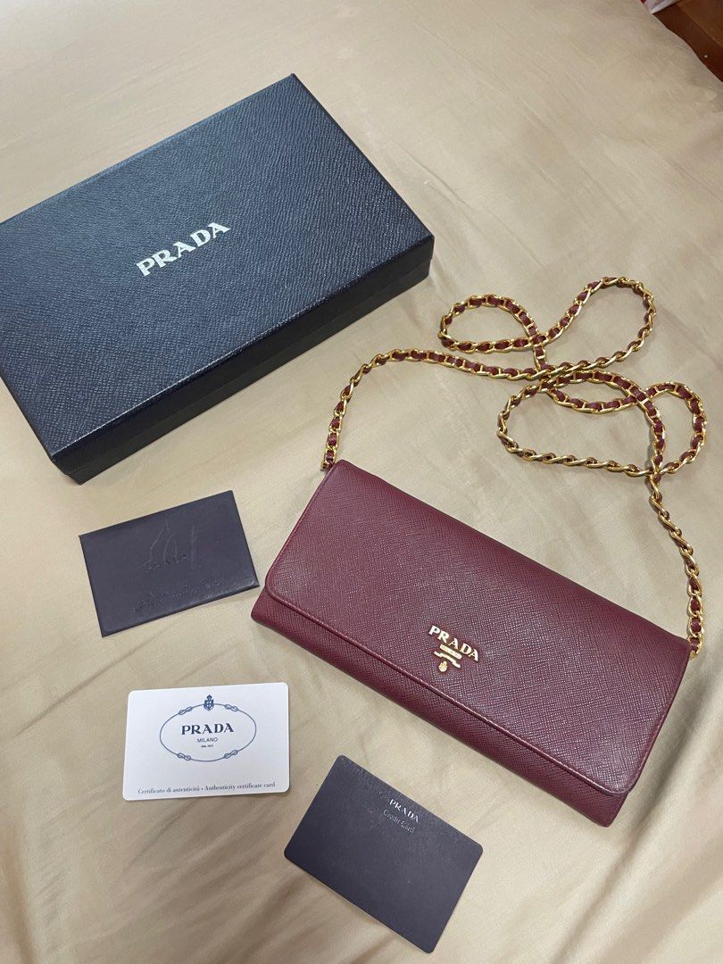 Prada Saffiano Wallet on Chain WOC (Category: Luxury Bags & Wallets) located in Quezon City. Submitted by wardrobebykeith (Listing ID 1298787871, Image 1). Description: Prada Saffiano WOC in Cerise (Maroon) Condition: 7.5/10 Flaw: “P” in Prada is a bit faded but not that apparent Complete with care card and box.