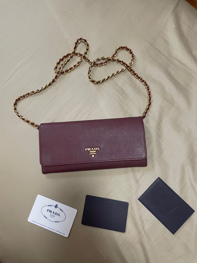 Prada Saffiano Wallet on Chain WOC (Category: Luxury Bags & Wallets) located in Quezon City. Submitted by wardrobebykeith (Listing ID 1298787871, Image 2). Description: Prada Saffiano WOC in Cerise (Maroon) Condition: 7.5/10 Flaw: “P” in Prada is a bit faded but not that apparent Complete with care card and box.