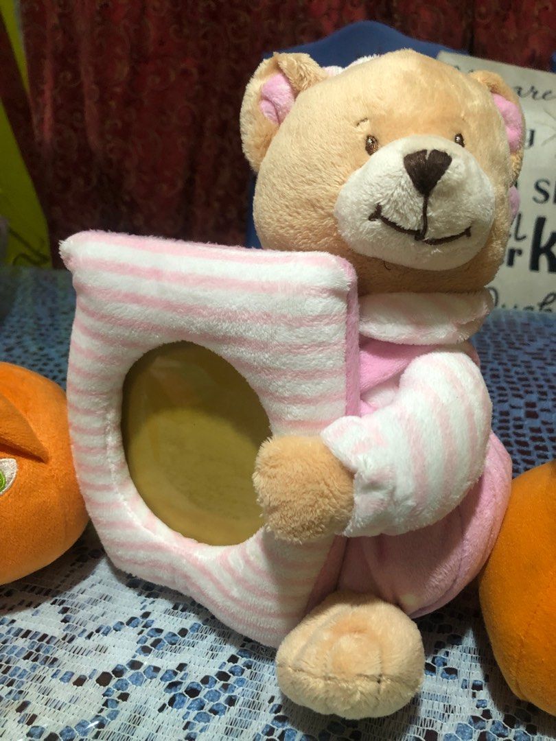 Preloved Baby Toys from Canada (Category: Infant Playtime) located in Taytay. Submitted by lisacali00 (Listing ID 1298649741, Image 2). Description: These items were gently used and then kept. Sold as a bundle for only 400 pesos Baby bear with picture frame 2 orange toys 3 pieces Fisher-Prize Peek-a-Boo Blocks GCash or Bank transfer .