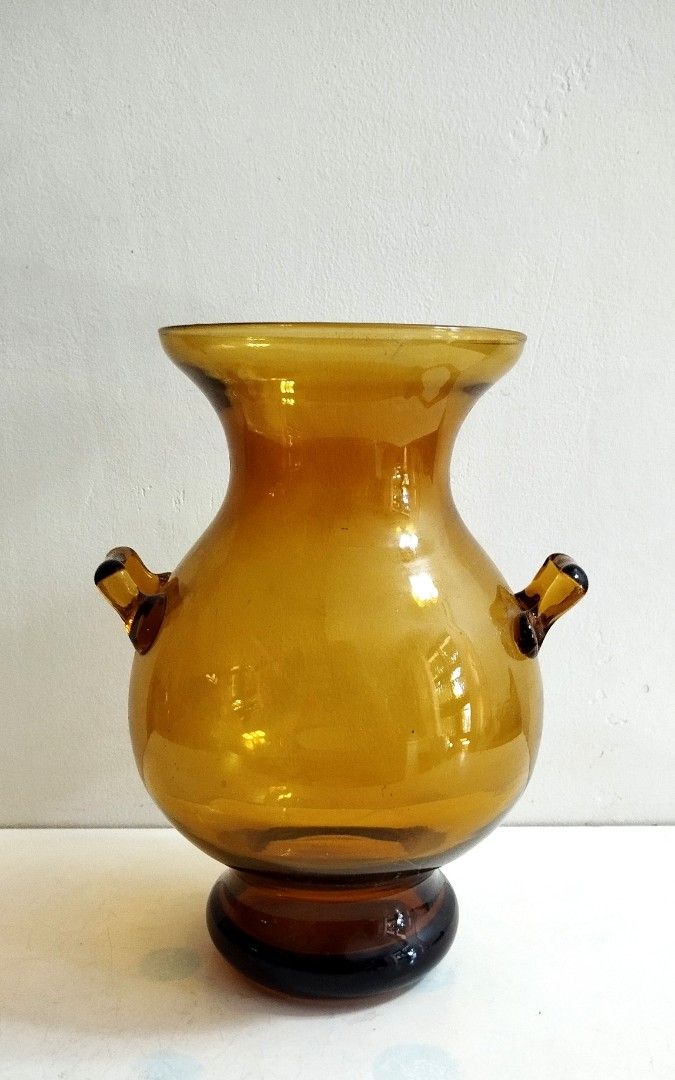 Amber Art Glass Vase (Category: Vases & Decorative Bowls) located in Marikina City. Submitted by macy_1024 (Listing ID 1298827831, Image 1). Description: Height: 9" Circumference: 18" With minimal flaw, see last picture..