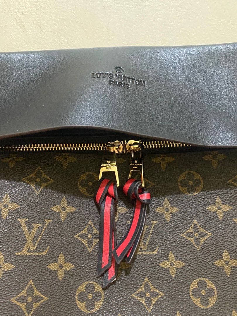 Louis Vuitton bag (2 way) (Category: Luxury Bags & Wallets) located in Quezon City. Submitted by ___rainbow___ (Listing ID 1298908307, Image 2). Description: Issue: see last pic ✅ leather type ✅ mabigat ❗️not authentic upon checking, but mabigat and nice yung leather Rfs: need cash, legit maganda to sa personal! Paayos niyo nalang.