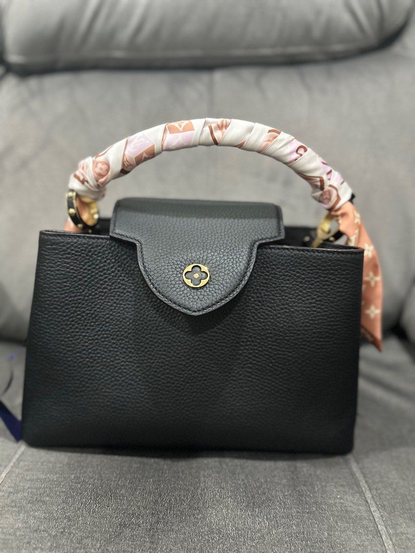 LV Capucine Noir MM w free twilly (Category: Luxury Bags & Wallets) located in Quezon City. Submitted by isabelhdp (Listing ID 1298884486, Image 2). Description: Purchase price of at HK Airport Louis Vuitton Capucine MM size Bag is made with Taurillon leather, comes with receipt, free twilly band all original For pick ups in Quezon City only.