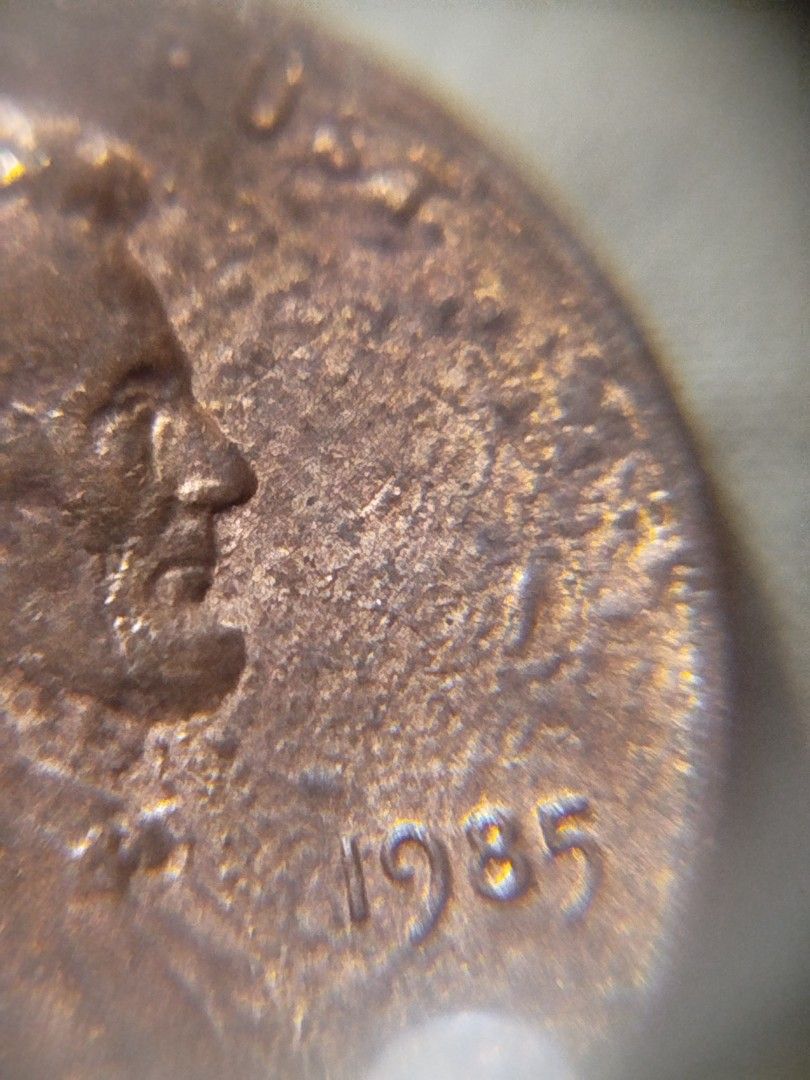 1985 Lincoln cent strike through grease error coin (Category: Currency) located in Subic. Submitted by regiedaniel01 (Listing ID 1299087103, Image 3). Description: with 2.6 grams.