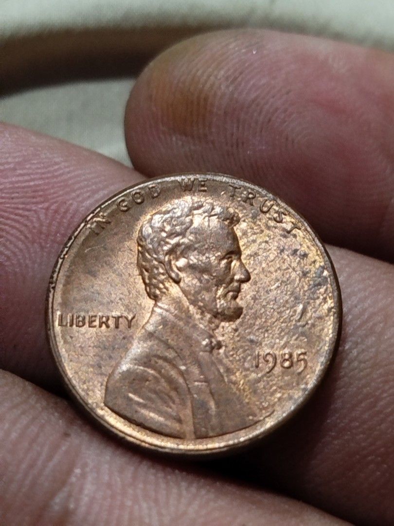 1985 Lincoln cent strike through grease error coin (Category: Currency) located in Subic. Submitted by regiedaniel01 (Listing ID 1299087103, Image 2). Description: with 2.6 grams.