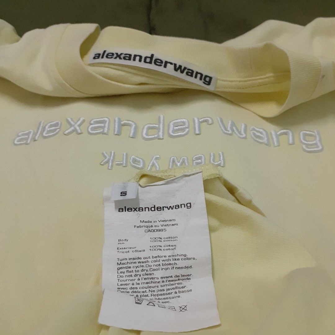 ALEXANDER WANG LIGHT YELLOW EMBROID CREWNECK TSHIRT (Category: Luxury Apparel) located in Navotas City. Submitted by riyuwi (Listing ID 1299053625, Image 2). Description: PREOWNED lightly Used AUTHENTIC ALEXANDER WANG EMBROID LiGHT YELLOW CREWNECKLINE TSHIRT Small on tag fits LARGE FRAME Cotton Good Condition 9/10.
