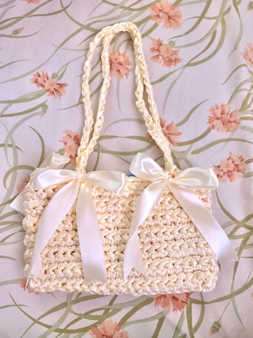 Satin Ribbon Crochet Shoulder Bag (Category: Shoulder Bags) located in Malolos. Submitted by august.leo (Listing ID 1287779851, Image 3). Description: 🧶 made to order !! (lead time is 3 days - 2 weeks) 🧶 other colors are available upon request. 🧶 l x h: 9 x 5.5” 🧶no zipper/buttons/magnetic closure 🧶 send a message for other requests 💳 gcash | bdo | maya 📦 j&t, orange app checkouts, lalamove/toktok 📍malolos, bulacan .