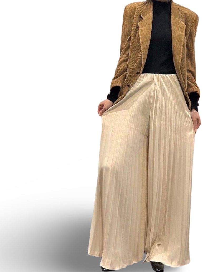 Stunning Pleated Palazzo Trousers (Category: Other Bottoms) located in Makati City. Submitted by cpicks_ph (Listing ID 1299041750, Image 1). Description: Beautiful Pleated Palazzo Pants in Cream Fits S Frames Excellent Condition Lxw: 41” x 24-28” waist.