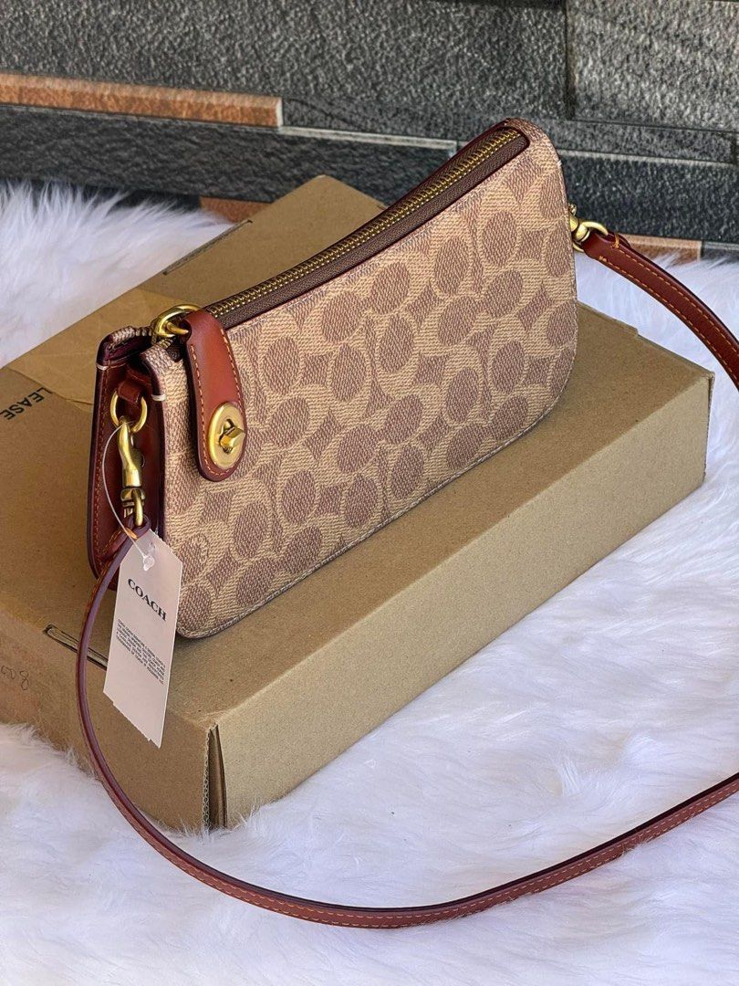 Coach penne shoulder bag (Category: Luxury Bags & Wallets) located in Mandaluyong City. Submitted by stuffnmore (Listing ID 1296366384, Image 1). Description: RETAIL ITEM Coach PENN shoulder bag Pinas onhand Inclusion tag dustbag polybag and carecard Guaranteed original and new Product Details Signature coated canvas and refined calf leather Three credit card slots Zip-top closure, leather lining Detachable strap with 30.5cm drop 21cm (L) x 12cm 