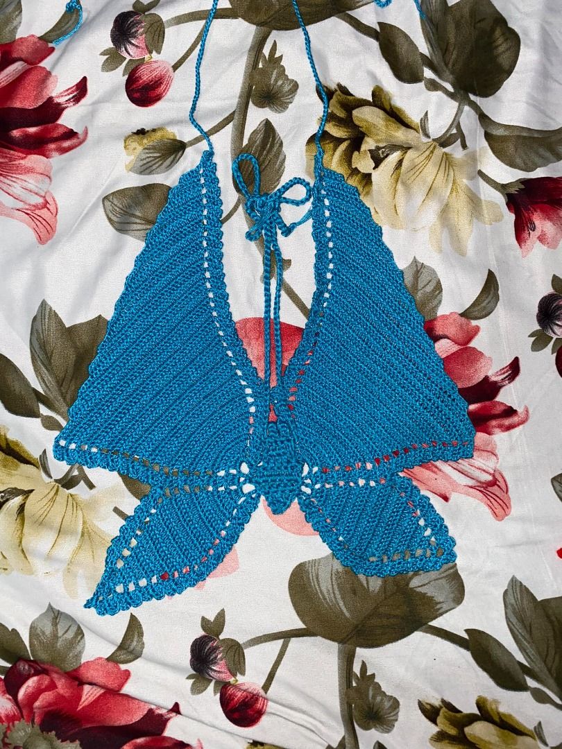 Crochet Butterfly Top (Category: Others Tops) located in Davao. Submitted by purple_stitch87 (Listing ID 1296250685, Image 3). Description: Introducing the enchanting Crochet Blue Butterfly Halter Top, an exquisite addition to your summer wardrobe, destined to elevate your OOTD (Outfit of the Day) game with its delicate charm and vibrant hue. Handcrafted with meticulous attention to detail, this halter top features a mesmerizing butterfly motif t
