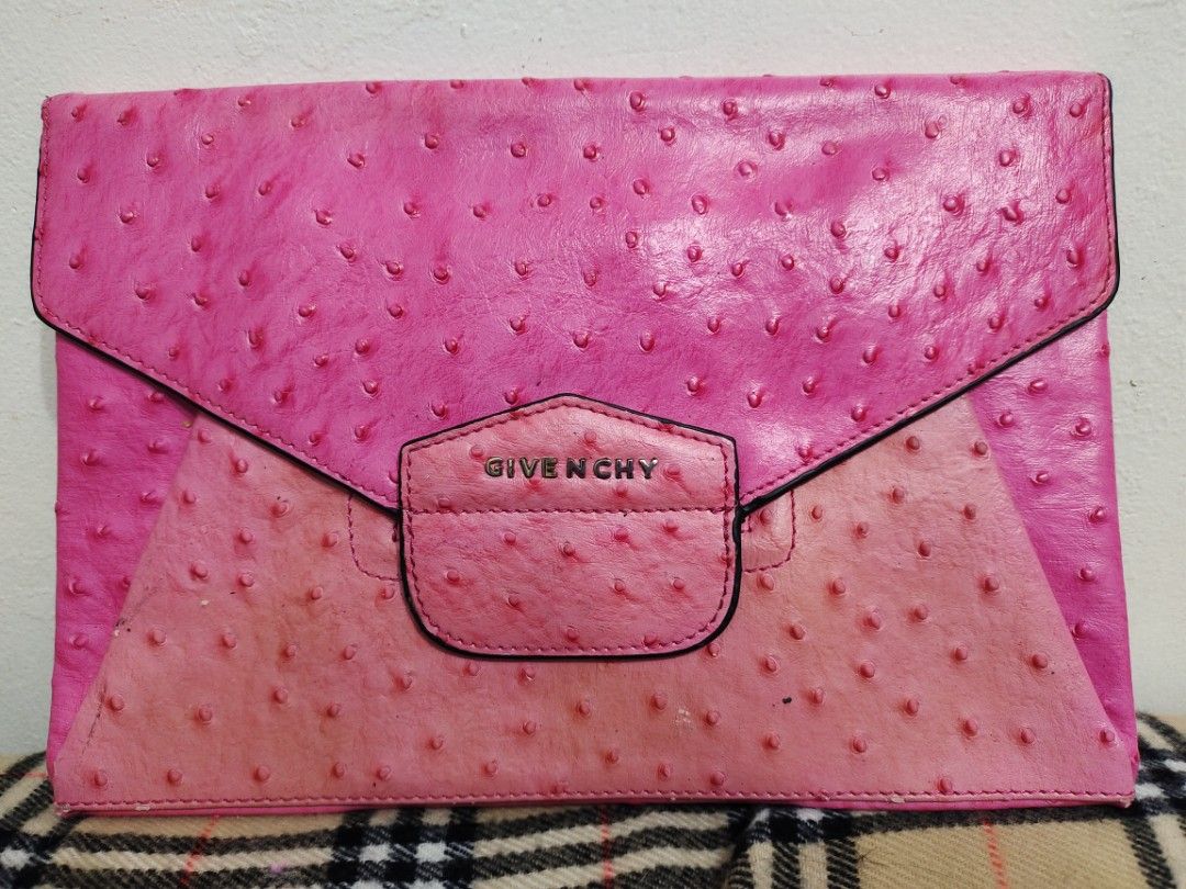Givenchy Ostrich Pouch (Category: Luxury Bags & Wallets) located in Baguio. Submitted by PreiLoveMaria (Listing ID 1296324487, Image 1). Description: Givenchy Ostrich Pouch signs of wear please check detailed Photos ❤️ from Ukay Box Shipping via J&T only NO COD/COP.