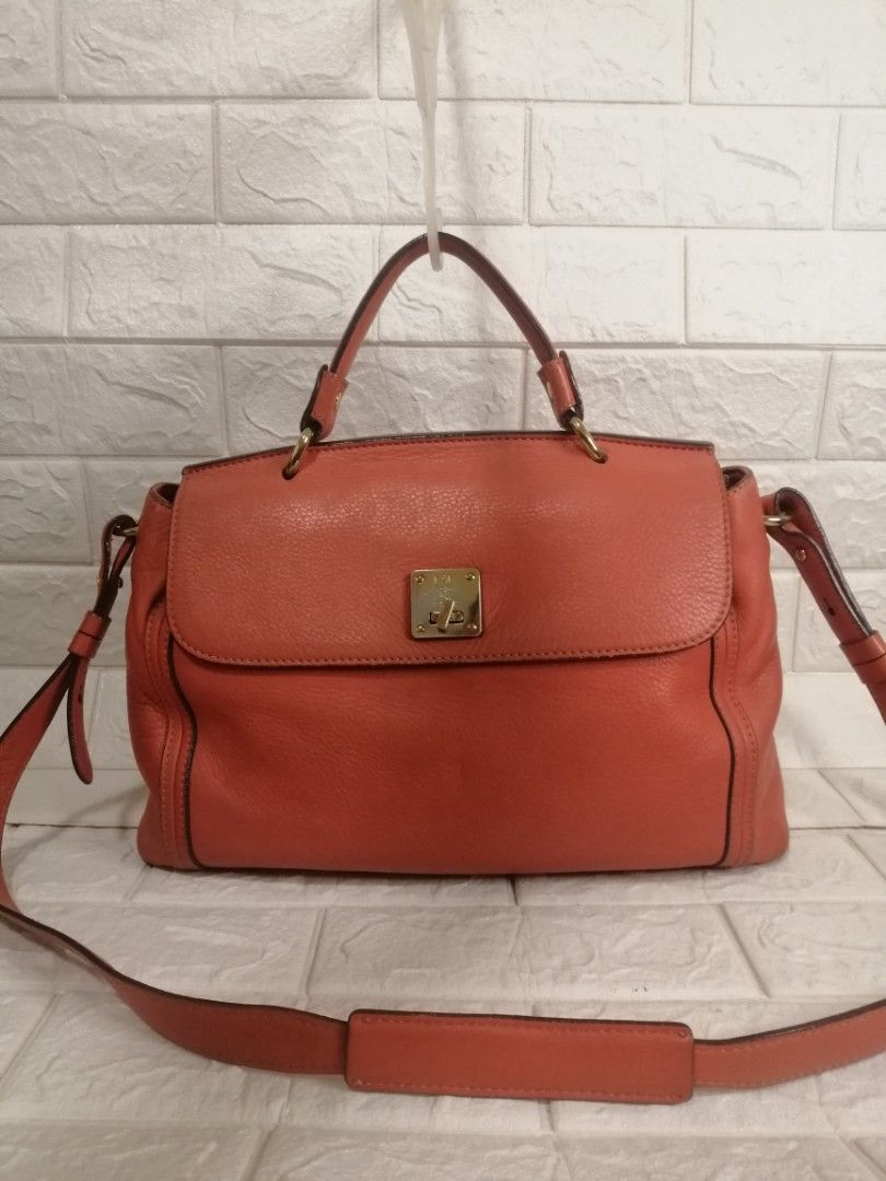 MCM Munchen 2-way Leather Satchel Bag (Category: Luxury Bags & Wallets) located in Las Pinas. Submitted by etoksi1234 (Listing ID 1296380319, Image 1). Description: Pre-loved MCM Munchen 2-way Leather Satchel Bag. With minimal signs of usage please zoom in photos for reference. Size: L-14" x H-10" x D-4.5" Please manage your expectations. All sales are final. Kindly examine pictures carefully when buying online. No return, exchange policy..