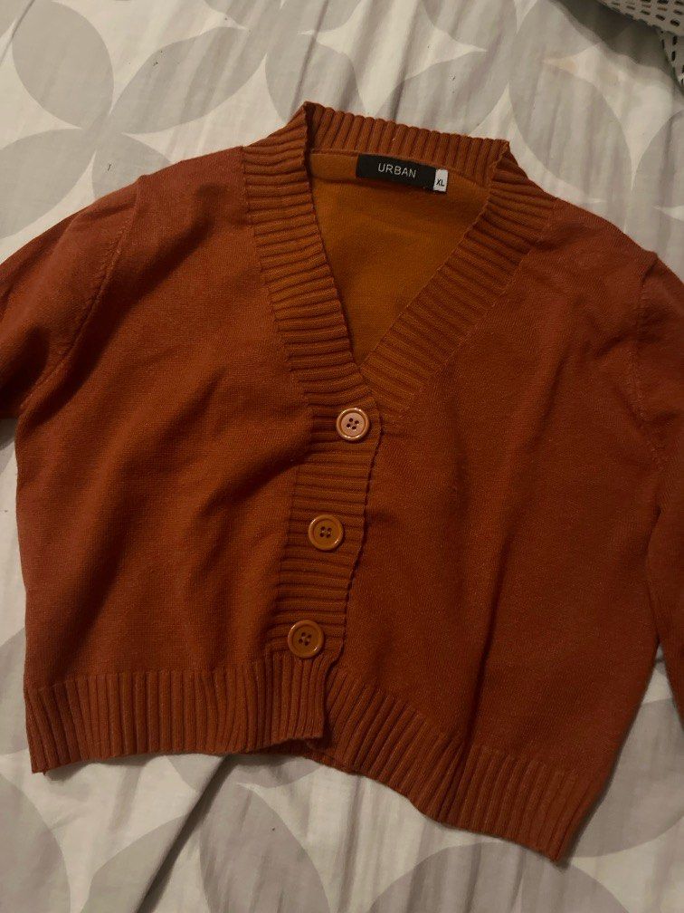 Orange Fall Cropped Cardigan (Category: Longsleeves) located in Quezon City. Submitted by nekes7 (Listing ID 1296373906, Image 2). Description: Only used 2 times. Bought this at 699. Brand: SM deptstore URBAN. This is a cropped cardigan top..