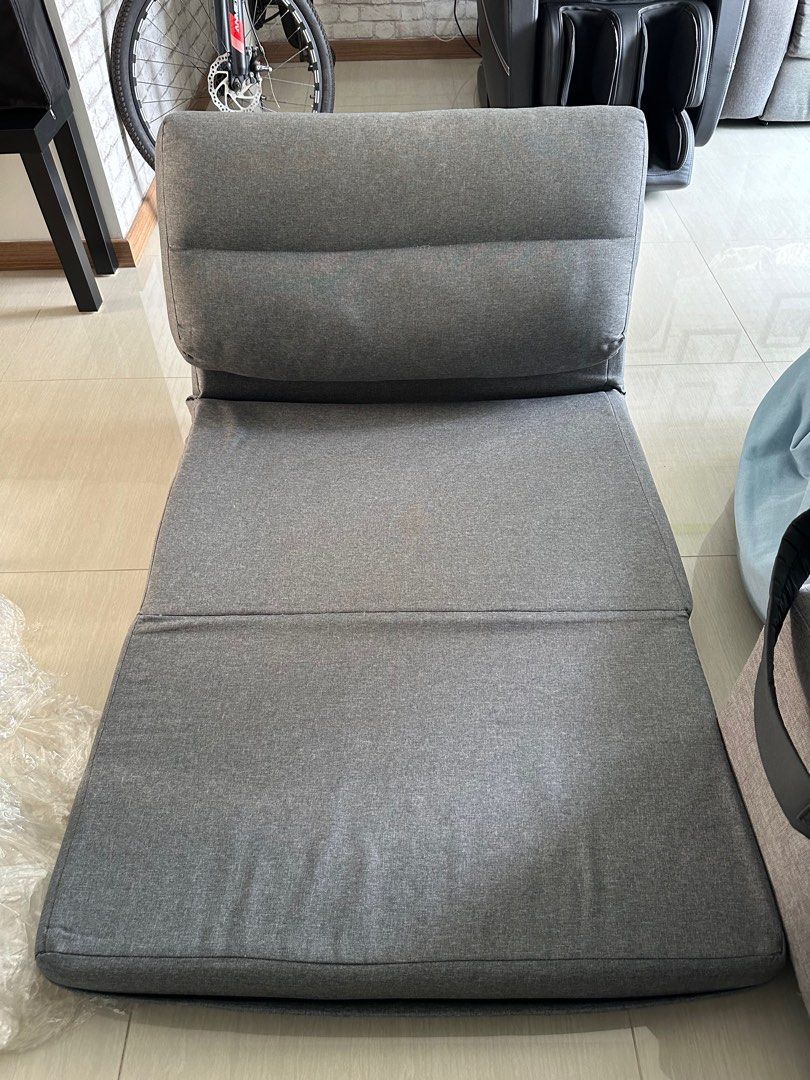 Sofa Bed (Category: Sofas) located in Singapore. Submitted by mumbojumbo111111 (Listing ID 1296310896, Image 3). Description: Foldable lazy sofa bed. 220cm length when fully extended, width is 85cm. In good condition as it is rarely used. Original price is $149.