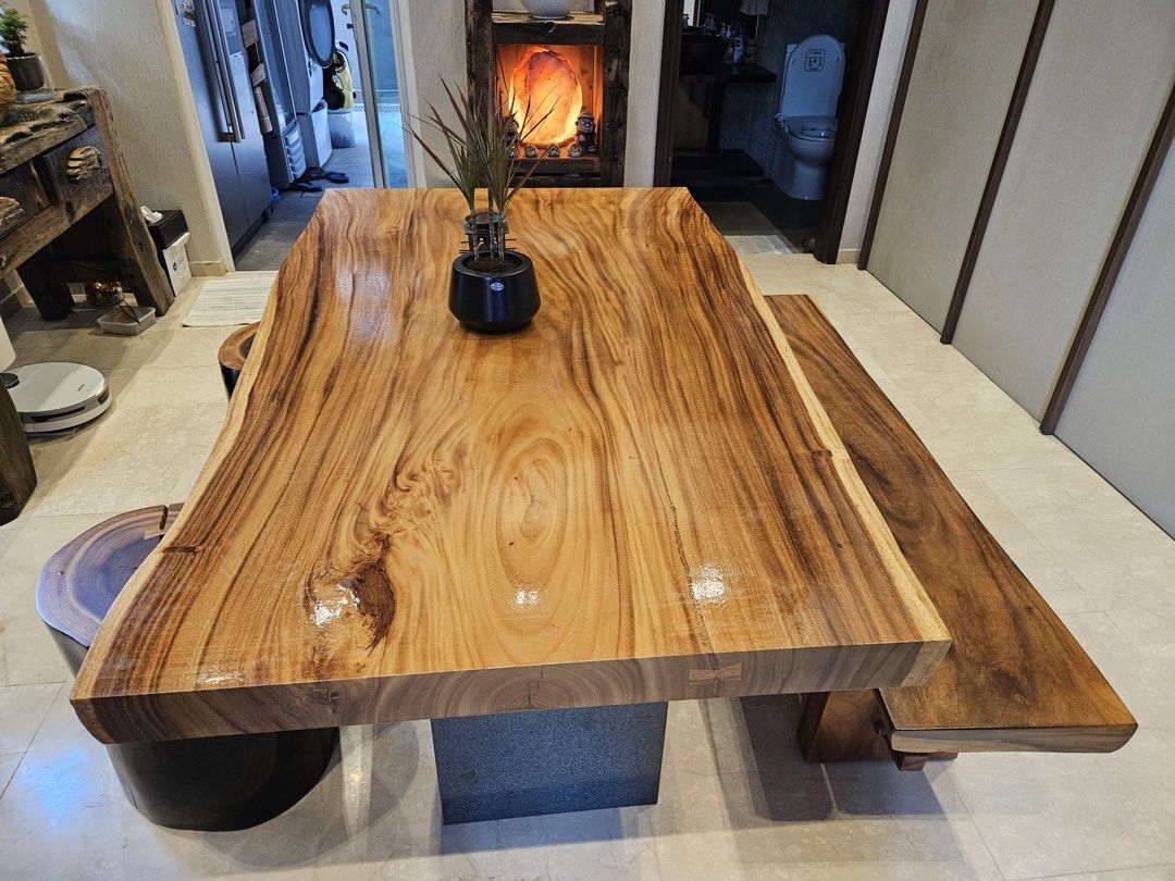 Solid Wood Dining Table (Category: Tables & Sets) located in Singapore. Submitted by newflower_6ea13f (Listing ID 1296252952, Image 2). Description: Made of suar wood. Suitable for family gathering. It comes with one long bench and 3 sitting log and 2 marble base . Buyer has to arrange their own transport. .