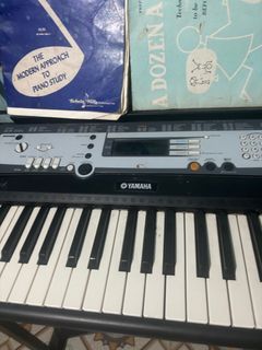 Yamaha PSR E213 portable piano keyboard with stand