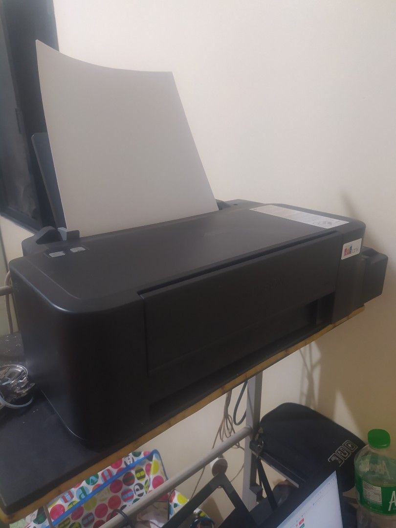 Epson L121 Single Function Printer (Category: Printers, Scanners & Copiers) located in Pasay City. Submitted by original.preloved88 (Listing ID 1299208363, Image 2). Description: READ CAREFULLY! Single Function Printer Pigment Ink (document, photo and sticker print) Ready to use Shark Teeth Removed ( for seamless printing on Glossy papers) search nyo nlng ano yun if ever di aware. no issue. No box but manual is included. Sure buyer only!!! .