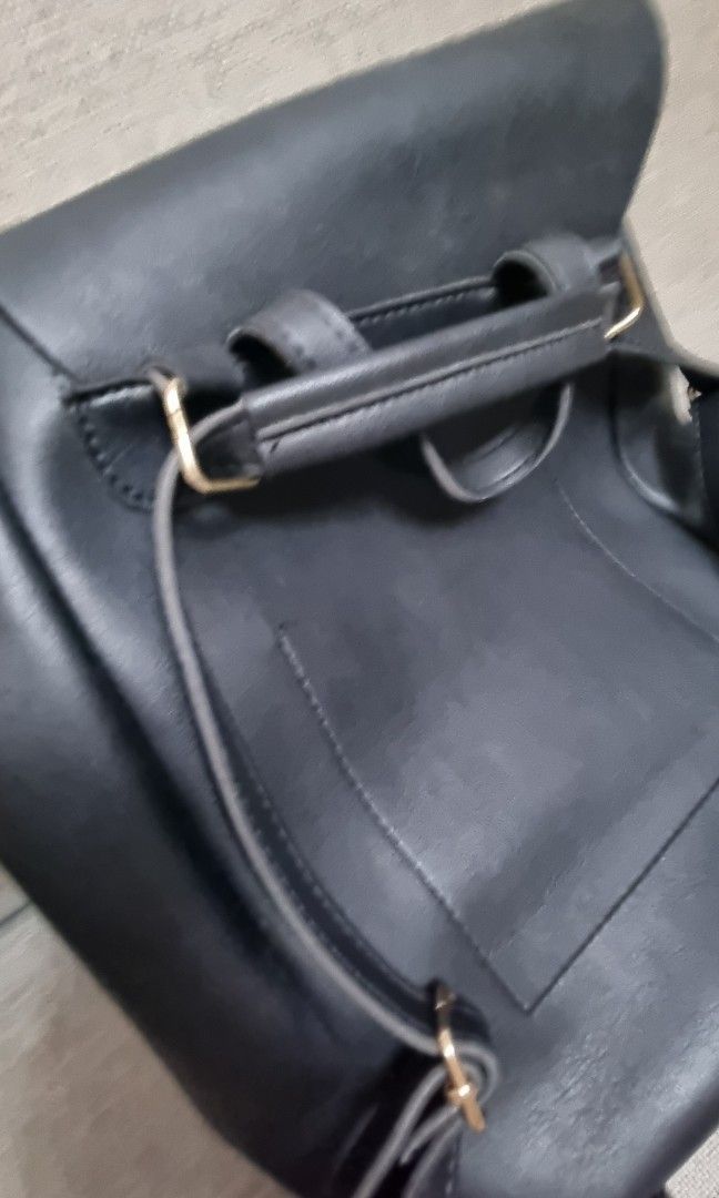 Leather Backpack with Flap (Category: Backpacks) located in Pasig City. Submitted by declutch_space (Listing ID 1299208668, Image 2). Description: Brand: Pink Tequilla bought from Zalora Size/ Dimension: Small 13 inches × 11 inches Color: Black Material: Leather and velvet texture inside - The buyer is responsible for covering shipping/delivery costs, which can be done through either Lalamove or Grab. - Mode of payment: G-cash.