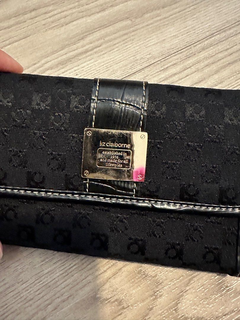 Liz Clairborne Wallet (Category: Wallets & Card holders) located in Makati City. Submitted by secondlife.inventory (Listing ID 1299174499, Image 2). Description: Liz Clairborne Black wallet Brand new (got as a gift but never used it) Has many compartments for cards and bills Has coin compartment BGC Meet ups or buyer pays for lalamove shipping.