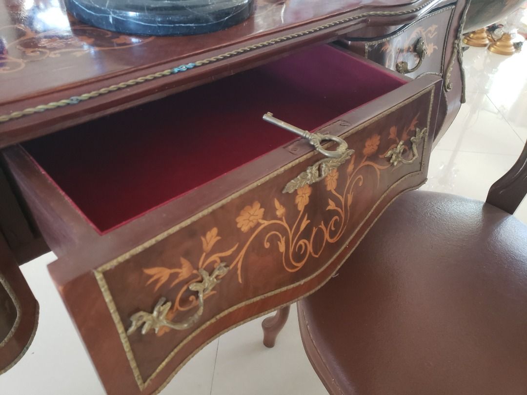 Victorian Office Table (Category: Tables & Sets) located in Mandaluyong City. Submitted by cherishla (Listing ID 1299118397, Image 3). Description: Imported Victorian -style office table, small in size that is perfect for your cozy little office space. Built elegantly with brass appliques, very sexy legs. It has 3 spacious drawers. The middle drawer comes with a vintage lock and key to get that Victorian feel completely. Chair not included..