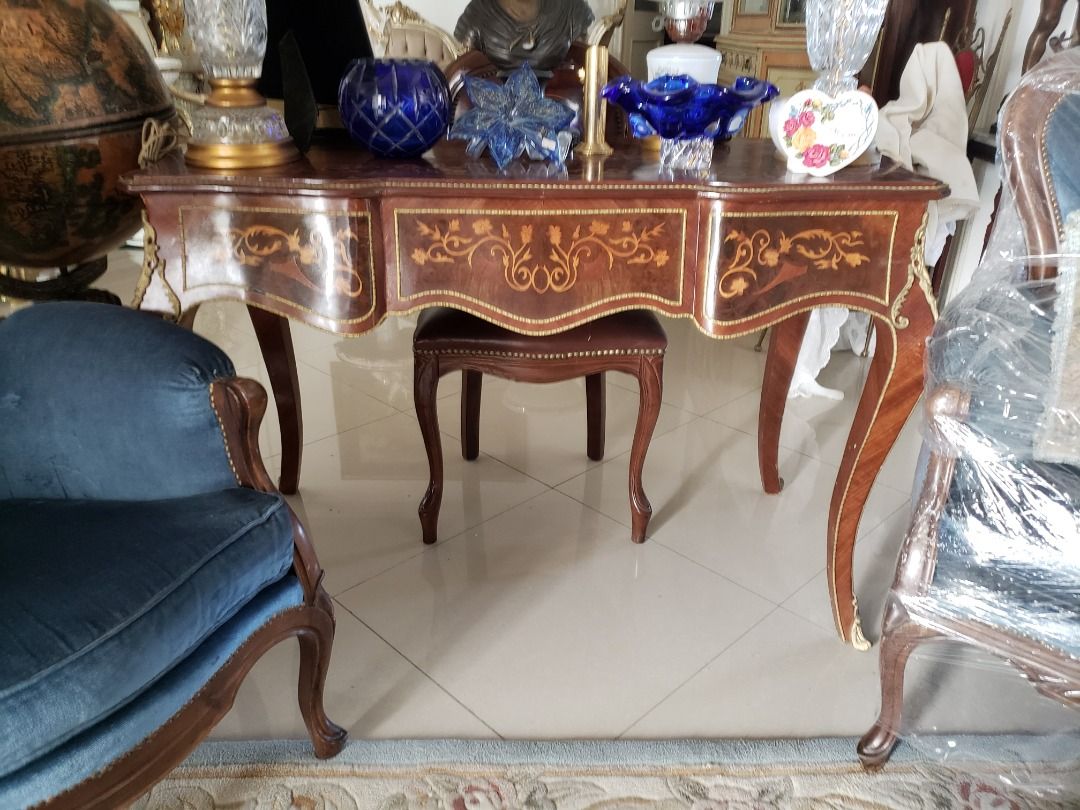 Victorian Office Table (Category: Tables & Sets) located in Mandaluyong City. Submitted by cherishla (Listing ID 1299118397, Image 2). Description: Imported Victorian -style office table, small in size that is perfect for your cozy little office space. Built elegantly with brass appliques, very sexy legs. It has 3 spacious drawers. The middle drawer comes with a vintage lock and key to get that Victorian feel completely. Chair not included..