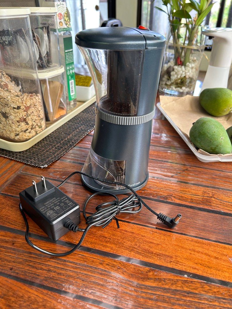 PureFresh Electric Coffee Grinder (Category: Coffee Machines & Makers) located in Las Pinas. Submitted by nikc12 (Listing ID 1299453599, Image 2). Description: PureFresh Electric Coffee Grinder Perfect for all kinds of coffee: espresso, moka, pourover, aeropress, French press Ceramic conical burrs Comes with box, grinder, power adapter Purchased last February 2024 Average use of 2-3x/week, burrs cleaned every week Absolutely no issues, running pe