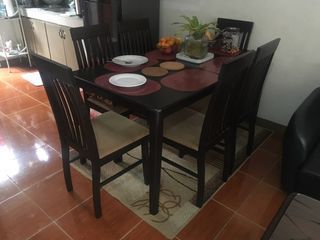 6 seater wooden dining table plus carpet