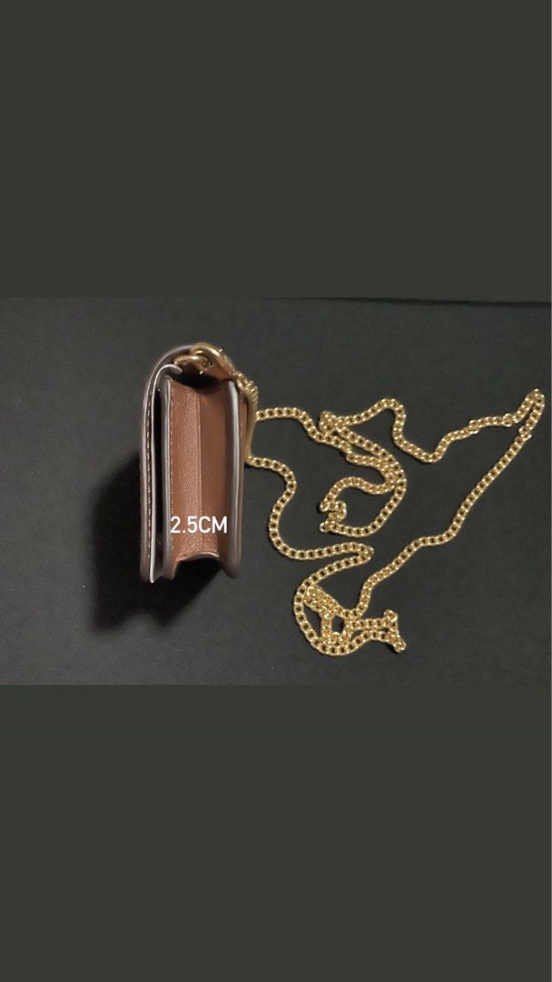 Coach Original Sling Wallet (Category: Luxury Bags & Wallets) located in Mandaluyong City. Submitted by deevirgo (Listing ID 1299475921, Image 2). Description: Authentic Coach sling Wallet/card case bought in the US. Material: Signature canvas and leather for back portion . With 2 Coach blings. Never been used. ₱5,000 only . DM if interested.
