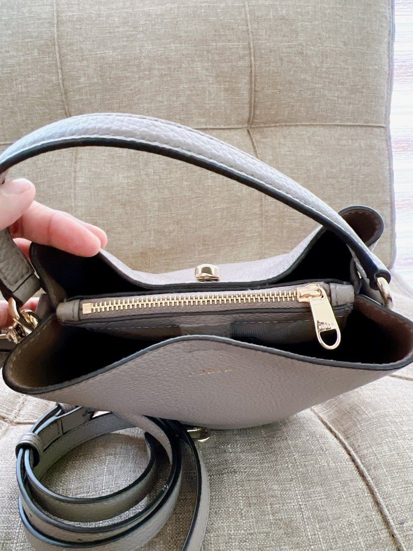Bnew Furla Danae small bucket bag (Category: Luxury Bags & Wallets) located in Antipolo. Submitted by minimalist.chic (Listing ID 1299505149, Image 2). Description: Please help me declutter. I'm selling bnew never used and preloved Items all in good condition. My preloved price depends on the quality of the items. Item Condition: - Bnew never used. Description: Bnew unused item, bought in hongkong. My Size: 5ft tall Size: small-medium, Chest: 36C