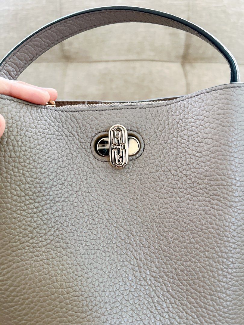 Bnew Furla Danae small bucket bag (Category: Luxury Bags & Wallets) located in Antipolo. Submitted by minimalist.chic (Listing ID 1299505149, Image 3). Description: Please help me declutter. I'm selling bnew never used and preloved Items all in good condition. My preloved price depends on the quality of the items. Item Condition: - Bnew never used. Description: Bnew unused item, bought in hongkong. My Size: 5ft tall Size: small-medium, Chest: 36C