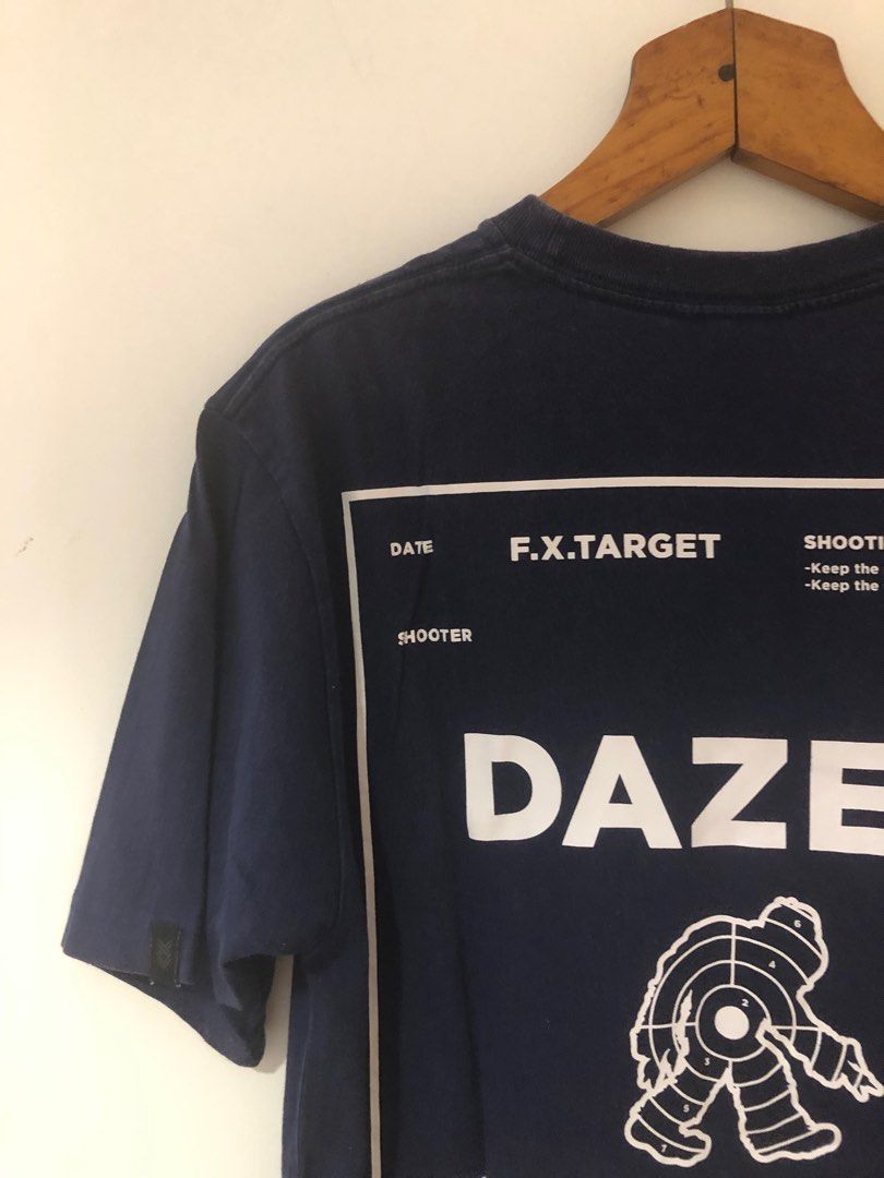 white and dark blue graphic tee