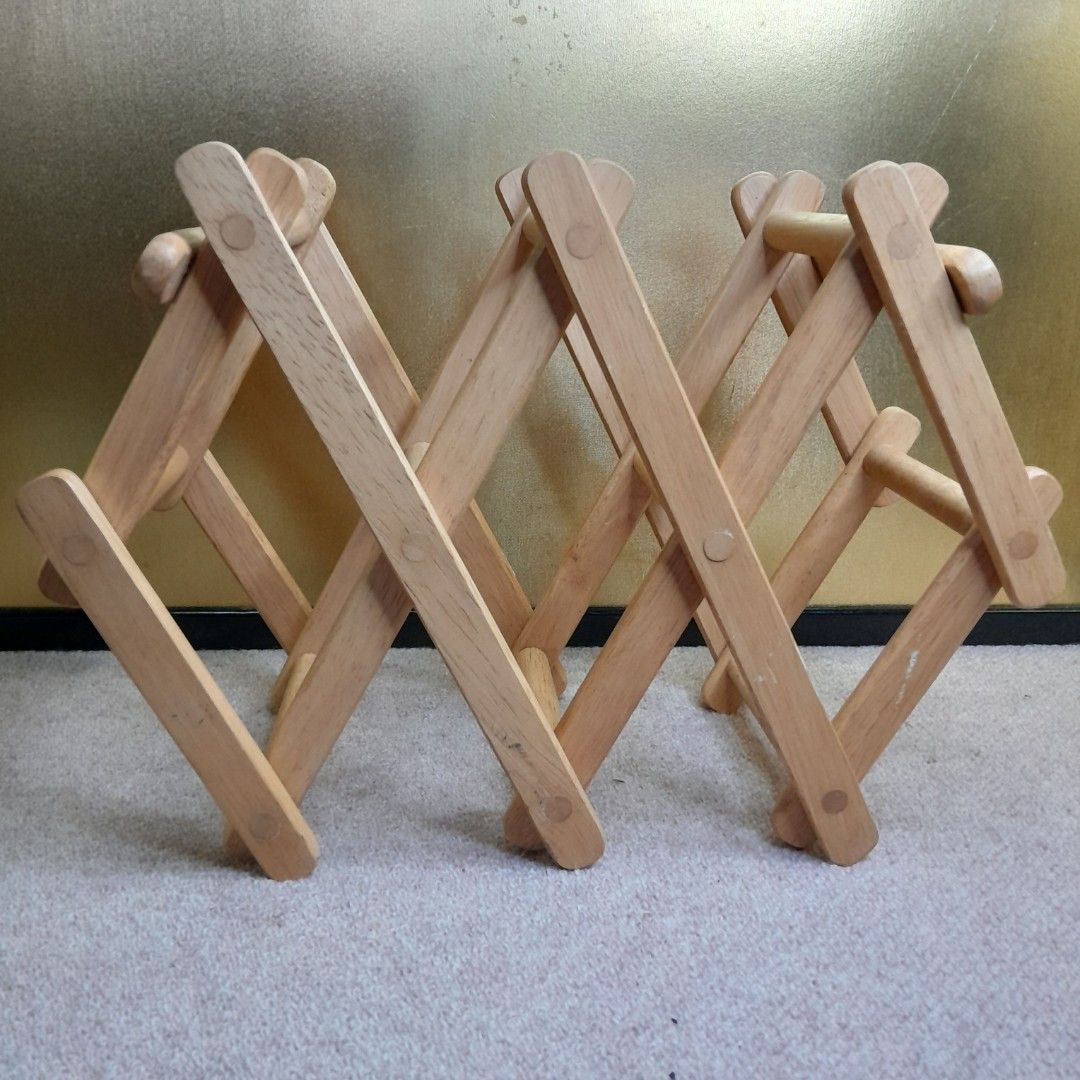 MINI BAR SOLID WOOD WINE RACK ACCORDION DISPLAY - 5 SLOTS (Category: Wine Cellar & Storage) located in Bulacan. Submitted by sakurajade (Listing ID 1299471313, Image 2). Description: MINI BAR SOLID WOOD WINE RACK ACCORDION DISPLAY - 5 SLOTS 👉 Price: P560 ONLY ✅️ Good condition, as good as new, decorative display, fits for small bars, 5 slots, sturdy ✅️ Material: Solid wood ✅️ Issue: Fits 8cm bottle only, no box.